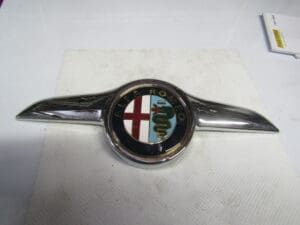 60681590 SIGLA FREGIO COFANO MOTORE ALFA GT NUOVO ORIGINALE