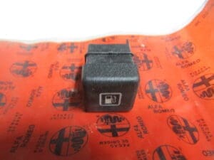 1122095 INTERRUTTORE APERTURA SPORTELLO SERBATOIO ALFA 164 NUOVO ORIGINALE