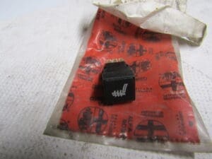 60805382 INTERRUTTORE RISCALDAMENTO SEDILI ANTERIORI  ALFA  155 NUOVO ORIGINALE