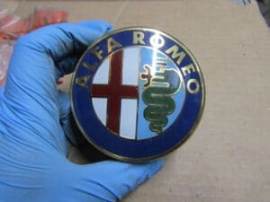 116939003701 STEMMA ALFA ALFETTA CON SUPPORTO NUOVO ORIGINALE