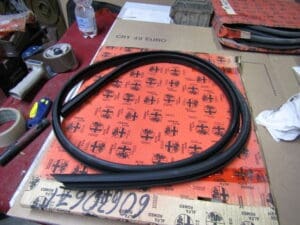 60630671 GUARNIZIONE SX GOCCIOLATOIO ALFA 145 NUOVO ORIGINALE