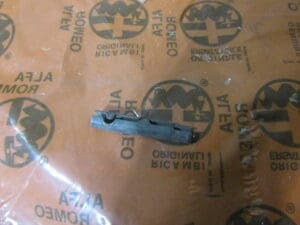60526580 SPINA PERNO FISSAGIO PORTE   ALFA 75 NUOVO ORIGINALE