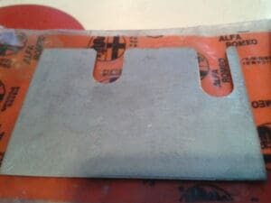 60595357 PIASTRINA PORTE ANTERIORI ALFA 145 146 155 NUOVO ORIGINALE