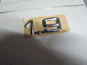 46548218   SIGLA MODELLO ‘ 1.9 ‘ ALFA 145 146 NUOVO ORIGINALE
